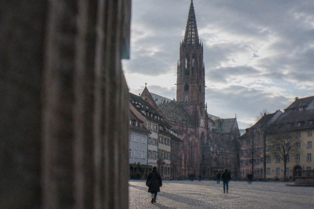 Rooftops of Freiburg im Breisgau with the red sandstone cathedral tower above the old town