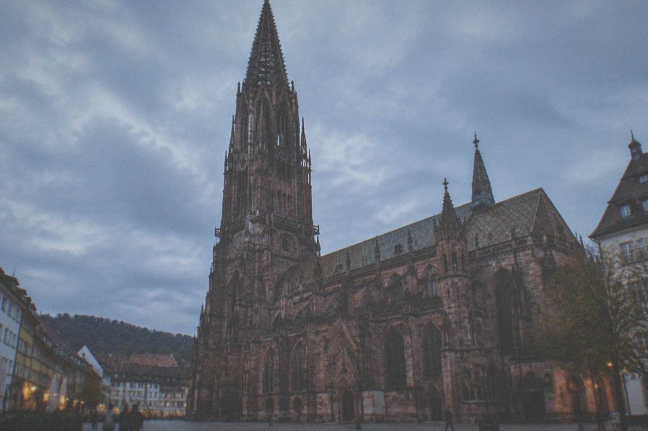 Freiburg Minster rising above the old town rooftops on a clear morning
