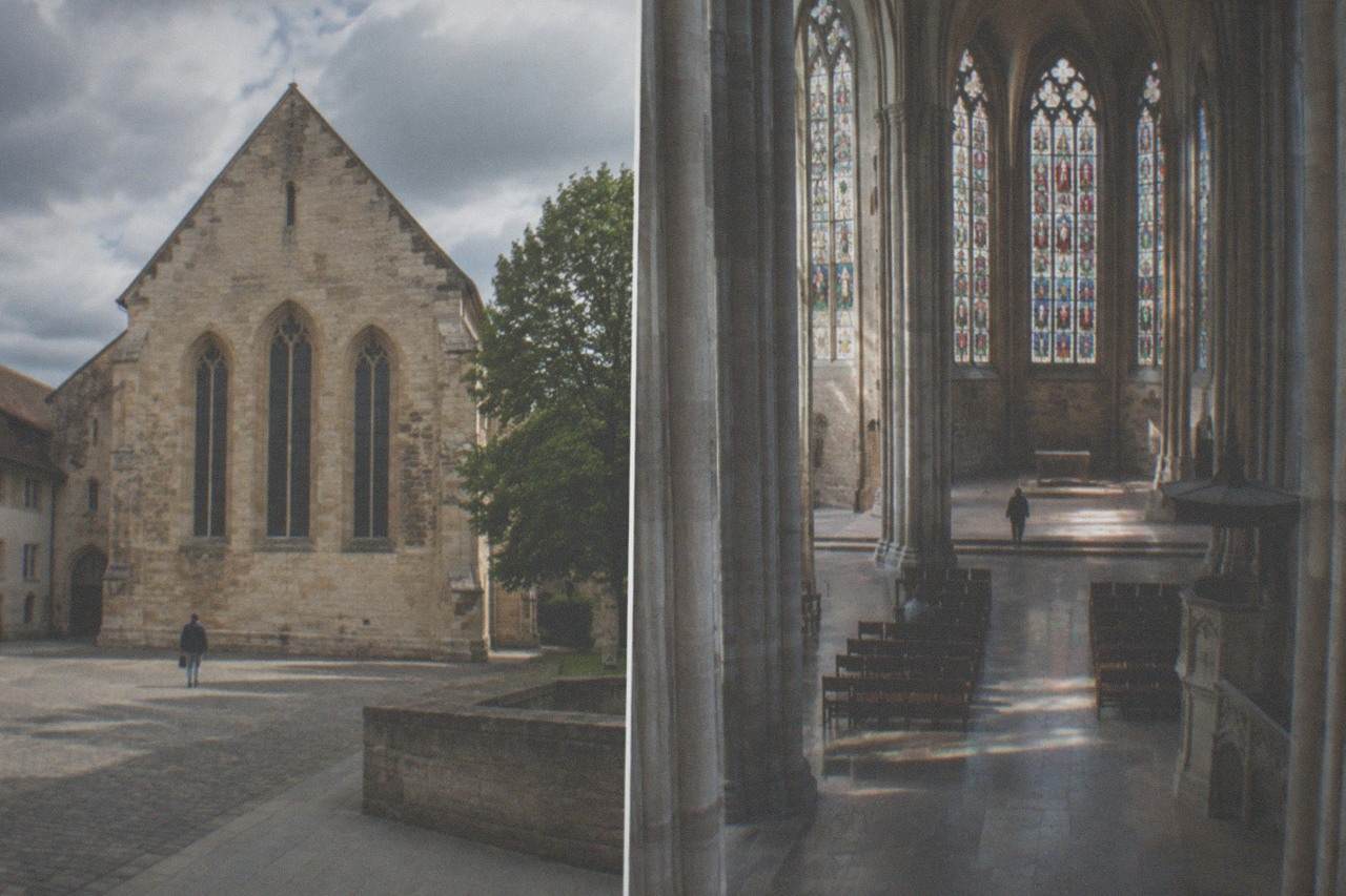 Gothic church interior of the Augustinermuseum with stone columns and stained glass windows