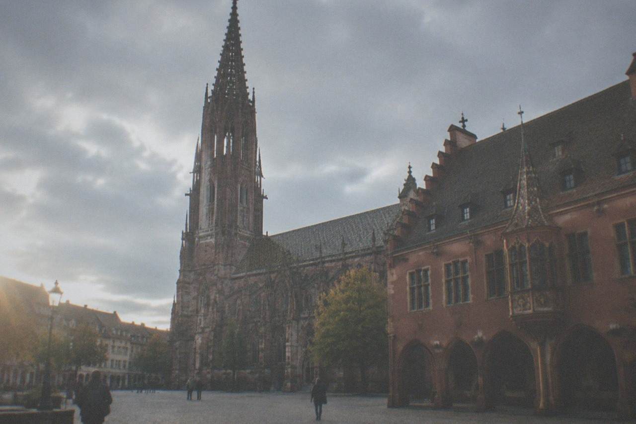 Historic town hall facade on a quiet cobbled civic square in Freiburg