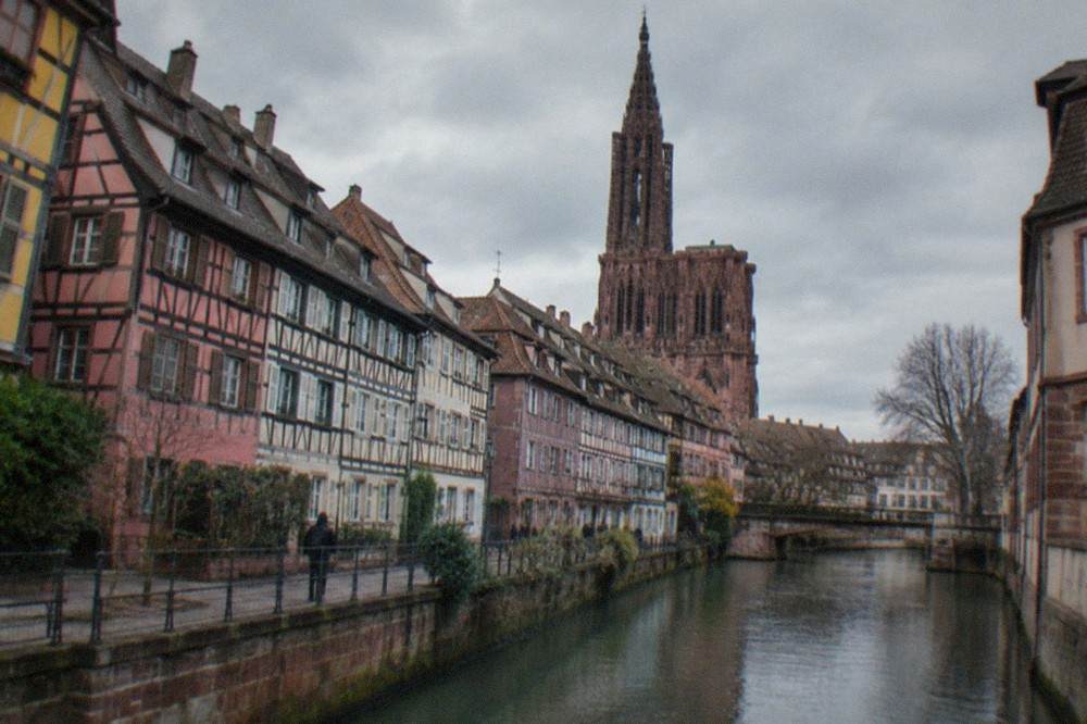 Gothic cathedral facade above a red sandstone square in Strasbourg