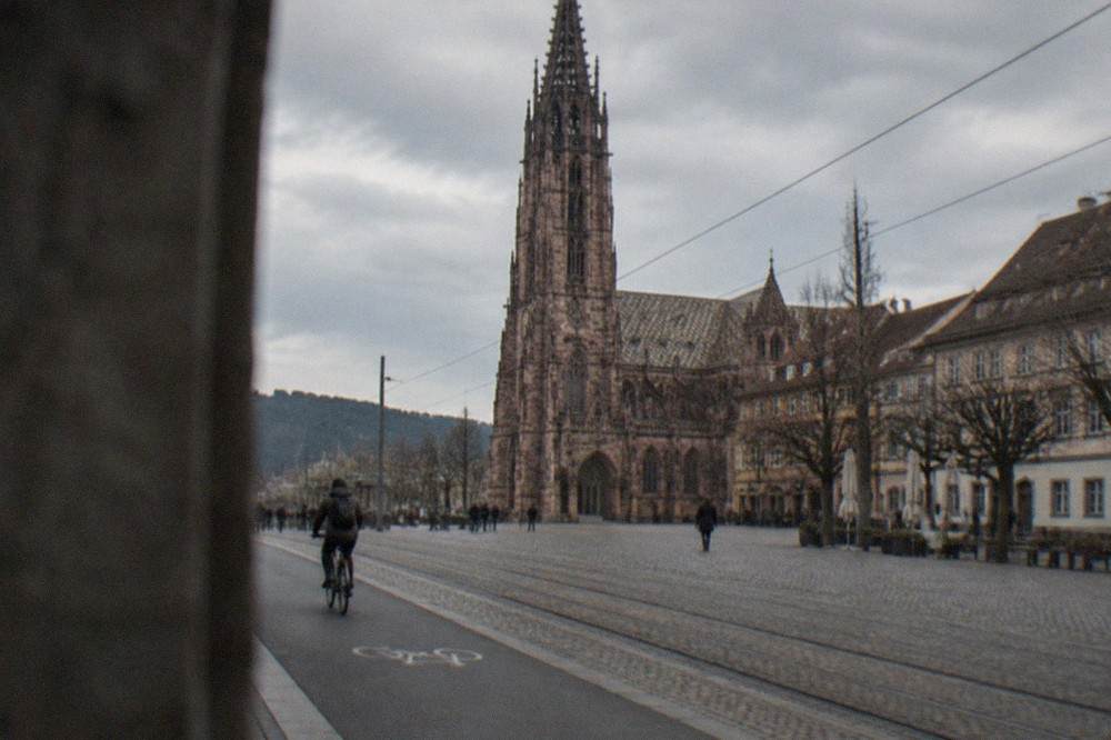 Wide separated bike lane running beside tram tracks in Freiburg