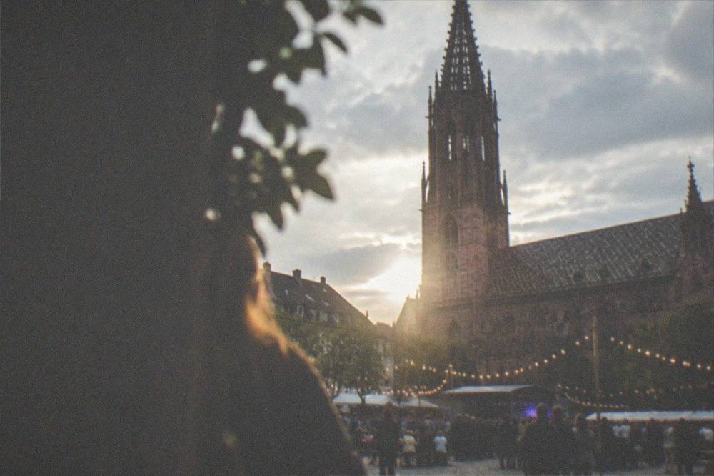 Festival lights and crowd at an open-air evening event near Freiburg