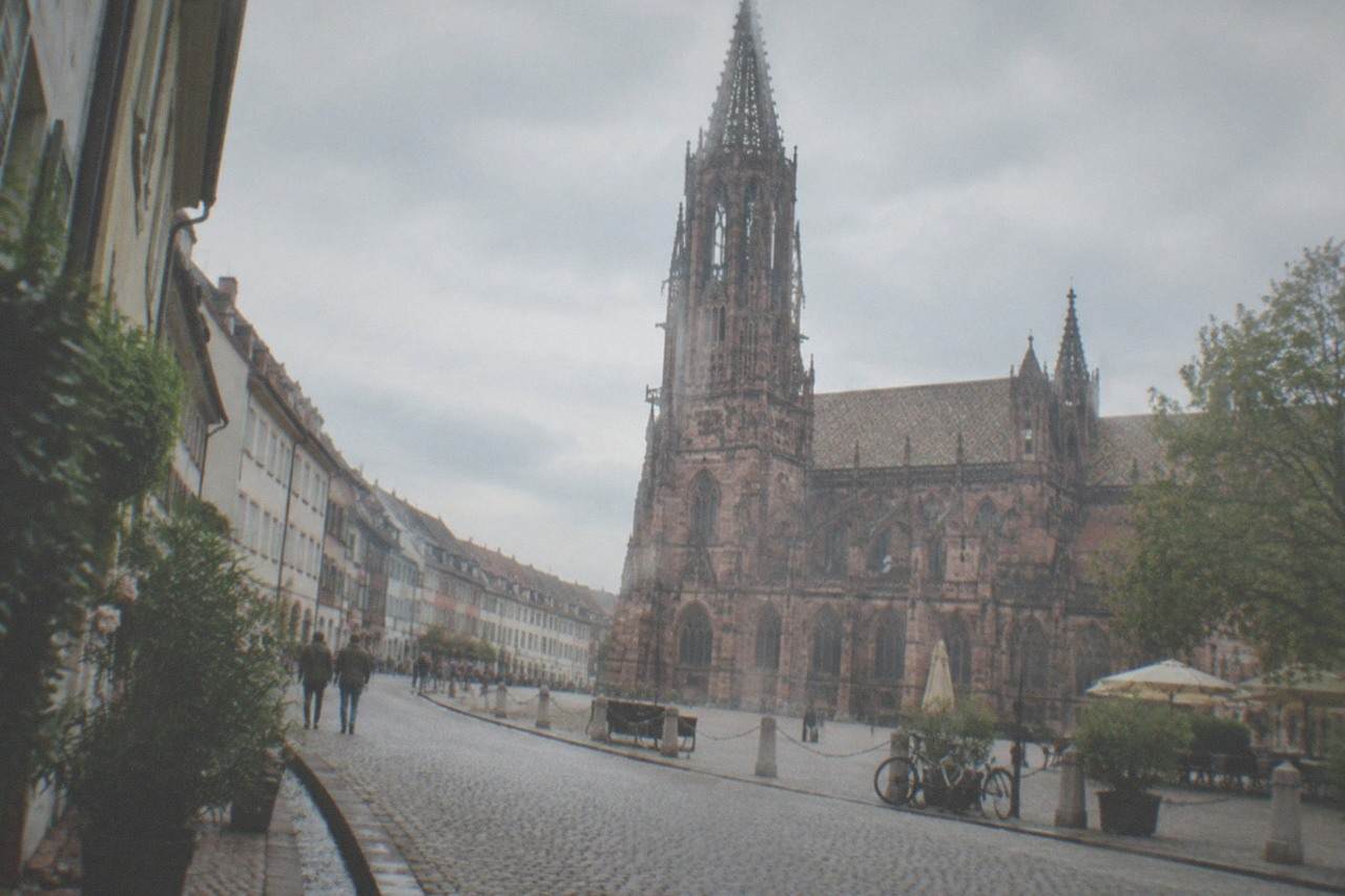 Cobblestone lane in Freiburg old town with small water channels running alongside the curb