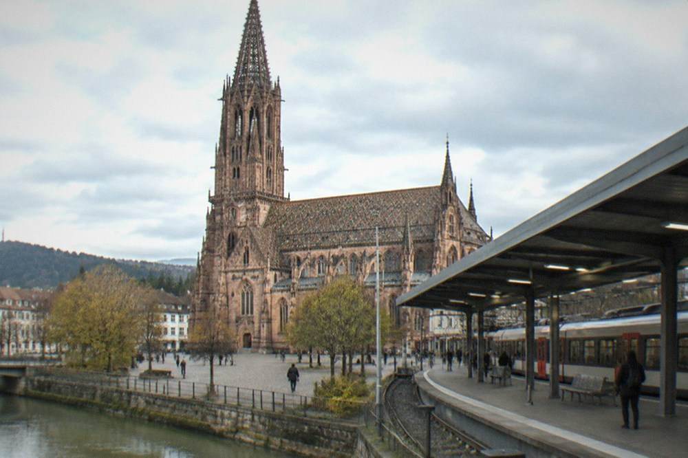 Regional train waiting at a platform under a modern station roof