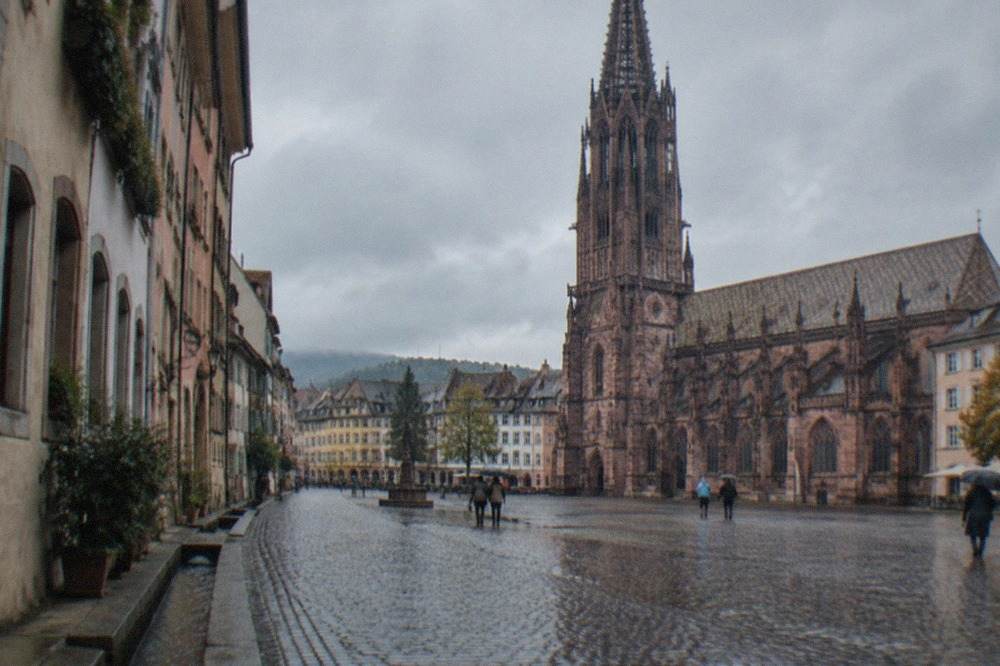 Cobblestone lane in the old town with small water channels running alongside the curb