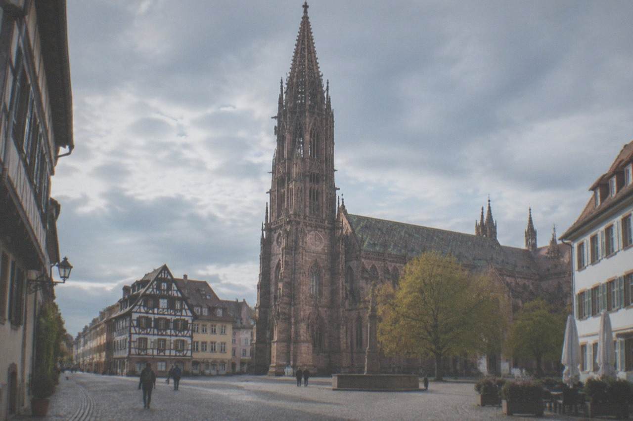 Cobblestone street in Freiburg old town with a narrow lane and half-timbered buildings
