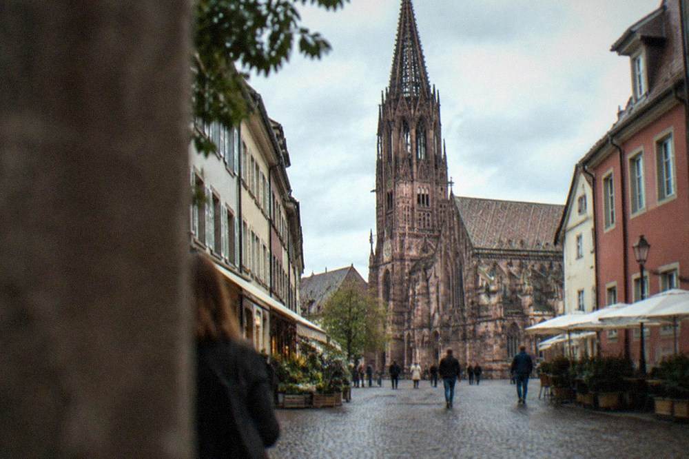 Small independent storefronts along a narrow lane in Freiburg old town