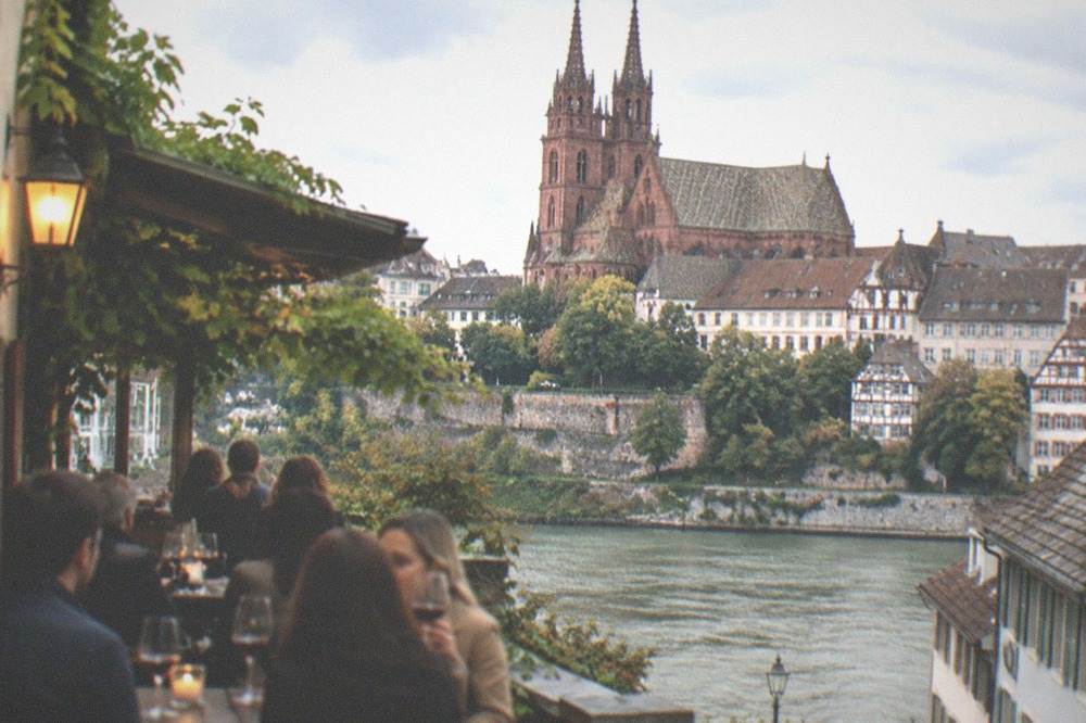 Evening crowd in a Baden wine tavern with glasses of red wine
