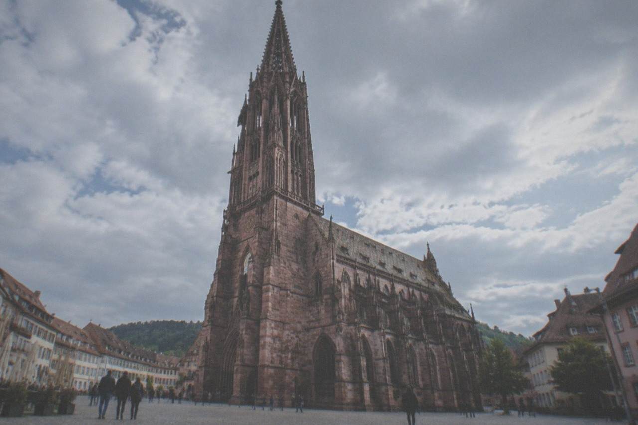 Freiburg old town rooftops with the Minster tower rising above the Rhine valley plain